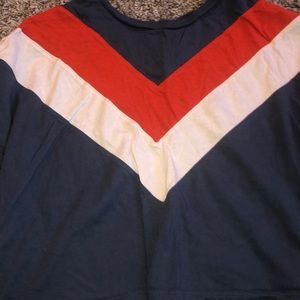 blue cropped top with orange and white